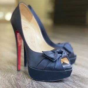 Black satin Louboutin pumps